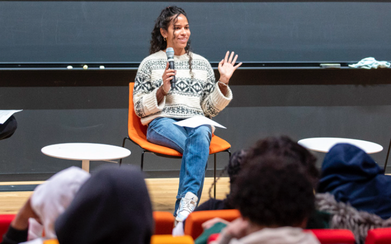 a woman talking on stage